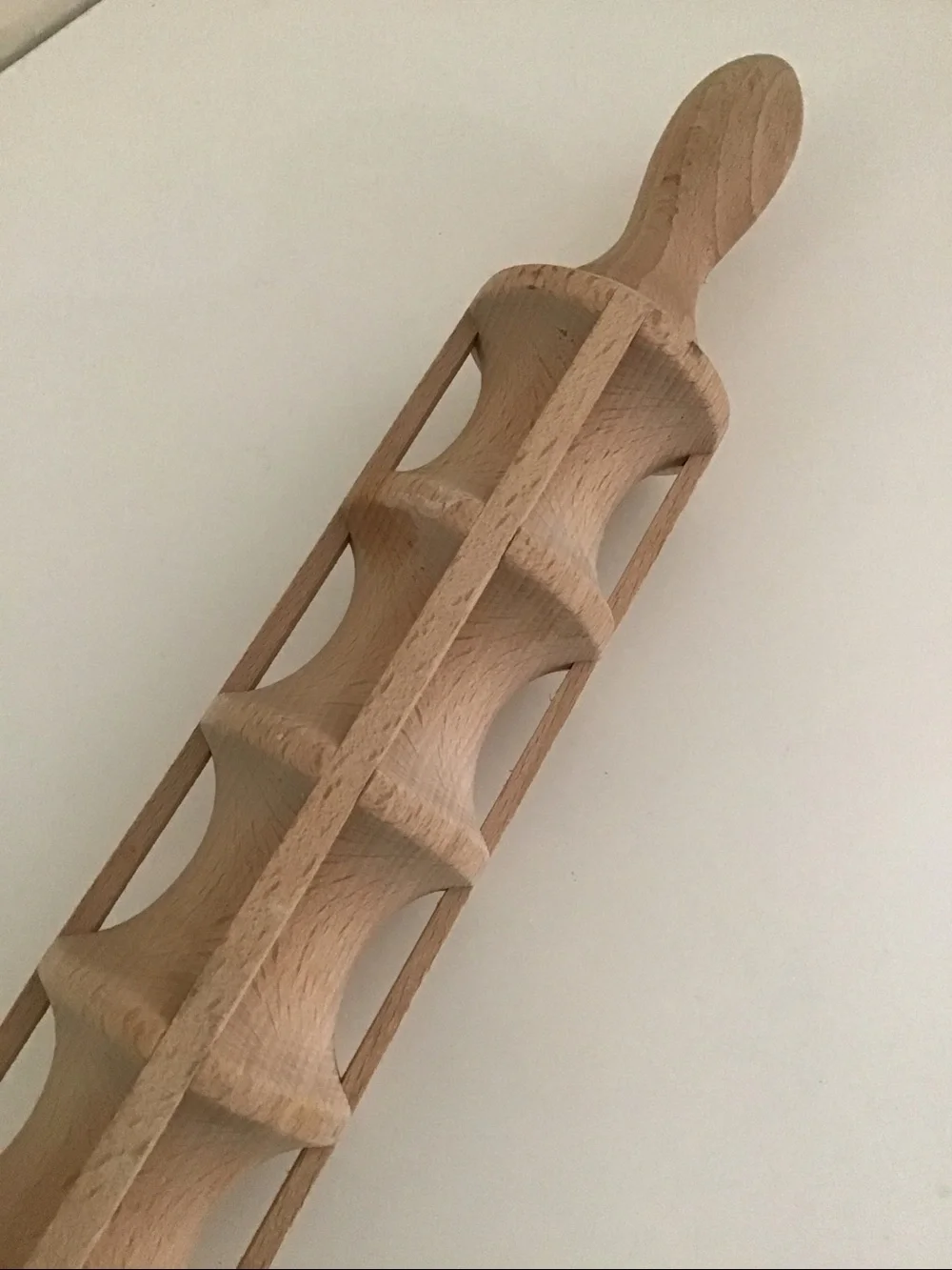 Traditional wooden ravioli rolling pin